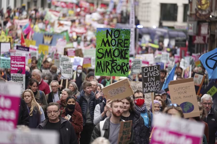 Climate protest march with people holding signs
